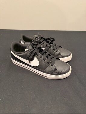 Nike women’s Black Sneakers with White Swoosh